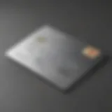 Close-up of a silver metal credit card on a sleek surface