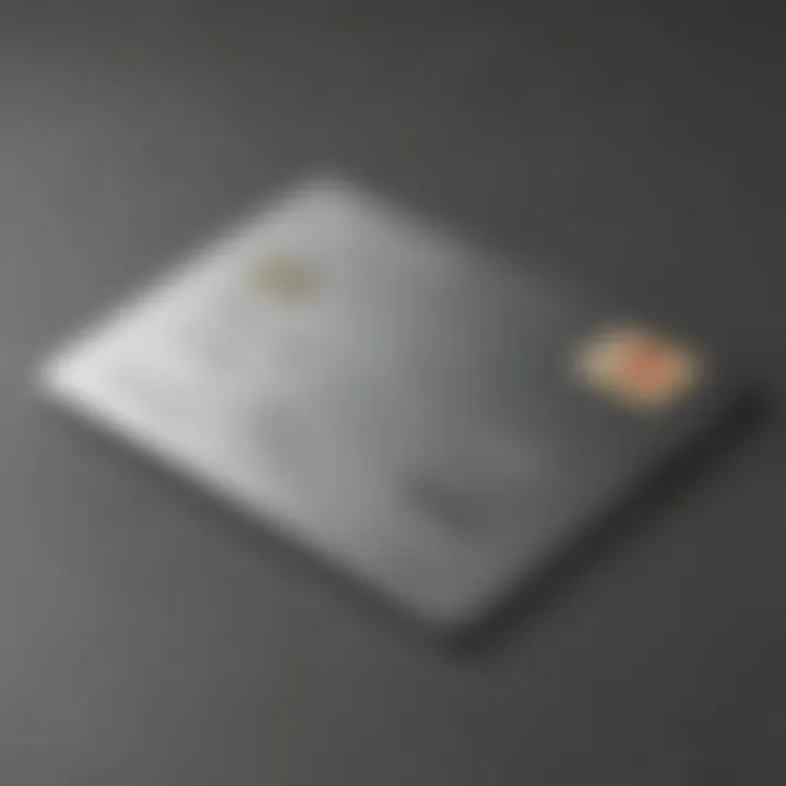 Close-up of a silver metal credit card on a sleek surface